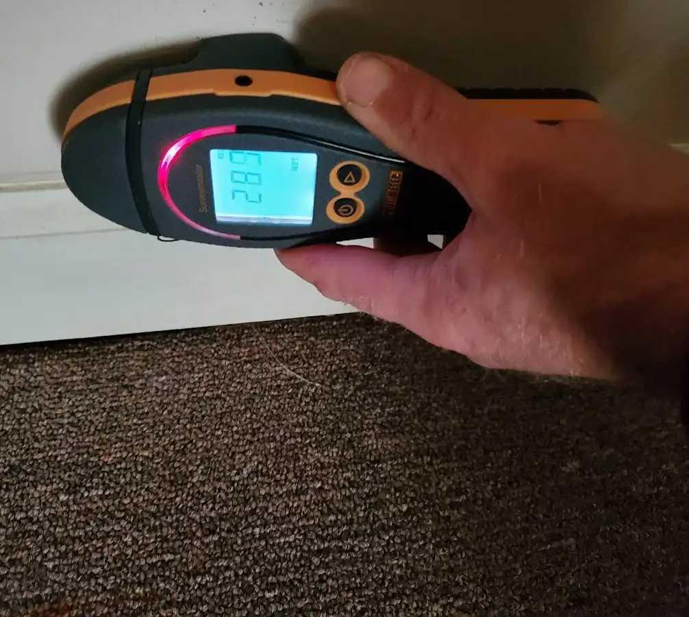 Moisture detection at baseboard during Sewage Cleanup & Sanitation in Tucson